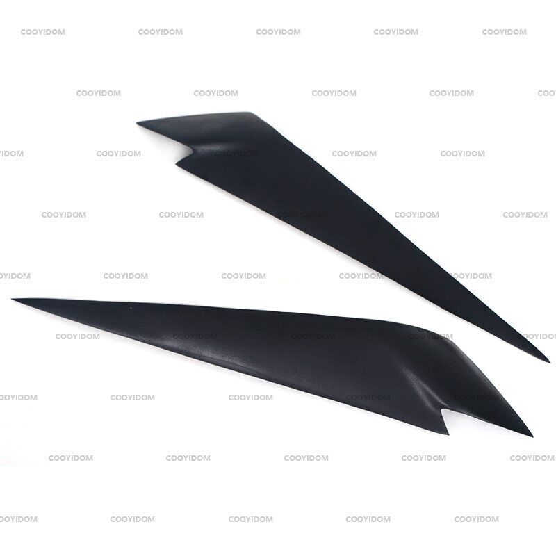 A pair of black headlight brow-shaped cover eyelid trims for 2009-2014 for BMW X1 E84