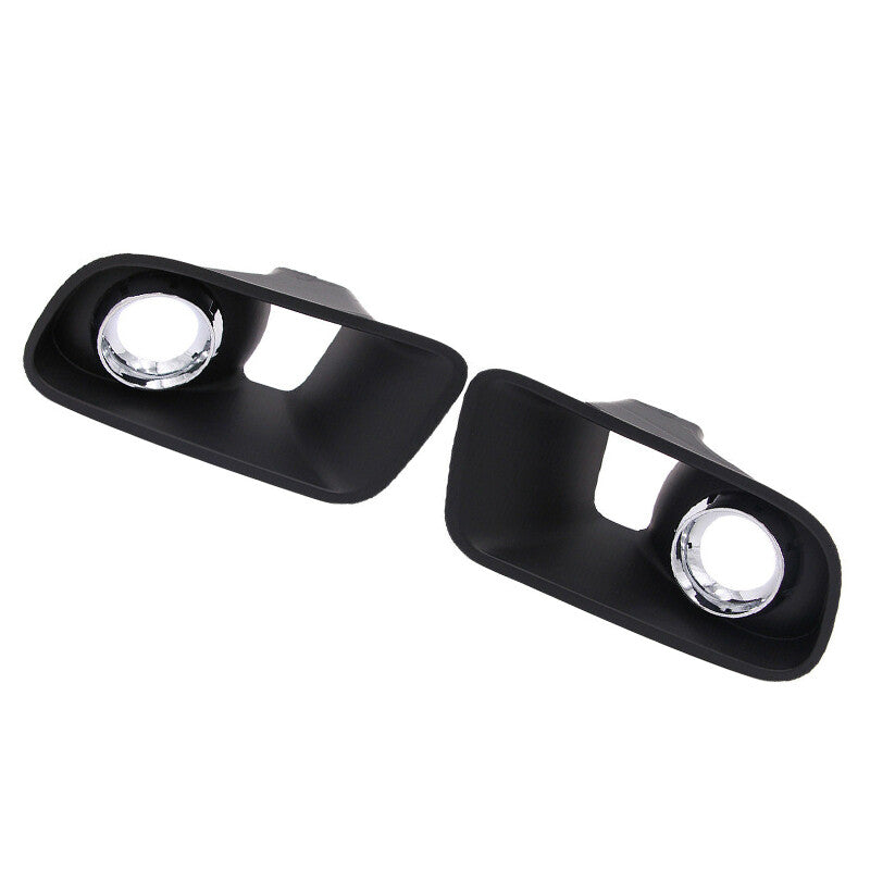 A pair of front bumper fog light covers for Dodge chargers from around 2012-2014. n