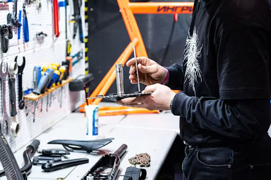 An independent garage owner using a tablet to execute an automated vehicle fitment routing database lookup.