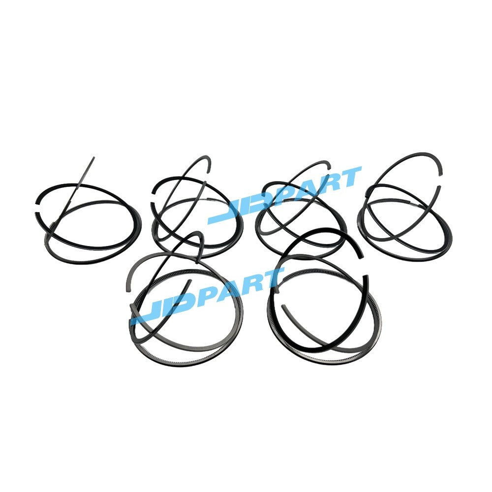 Premium 6-piece QSM11 piston ring kit for diesel engines.