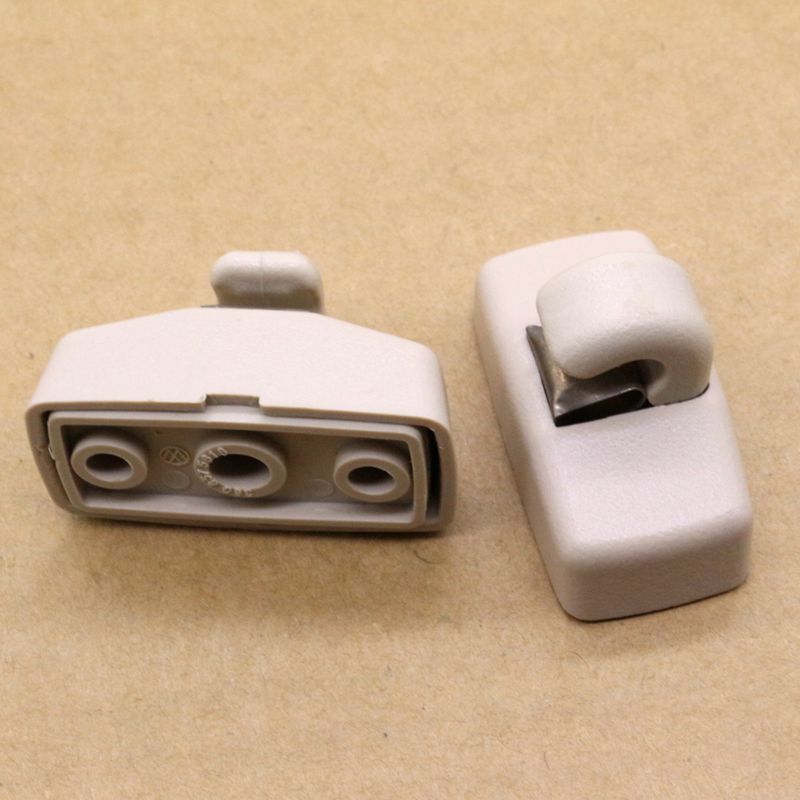 Two beige sun visor clip kits for Volkswagen for Jetta , for Golf , for Passat , Beetle, and for Skoda .