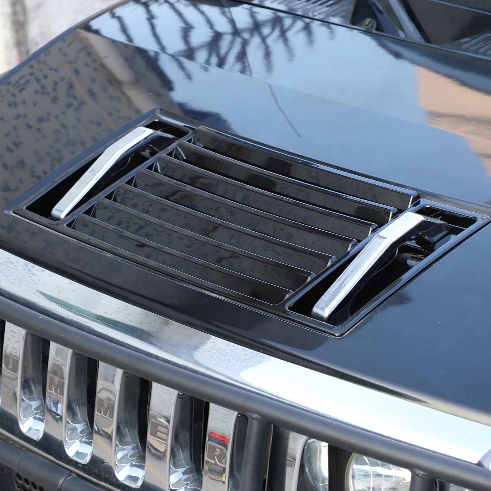Fits 2003-2009 for Hummer H2 front hood ventilated panel handle cover with glossy black trim.