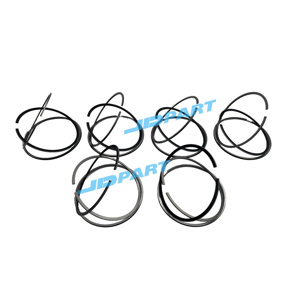 Premium 6-piece QSM11 piston ring kit for diesel engines.