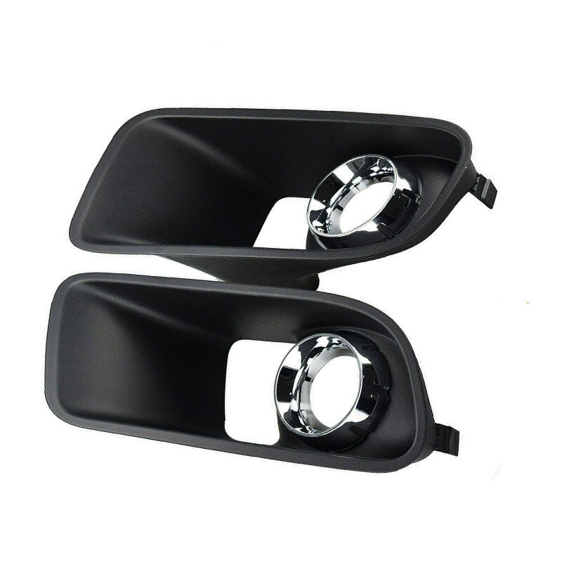 A pair of front bumper fog light covers for Dodge chargers from around 2012-2014. n