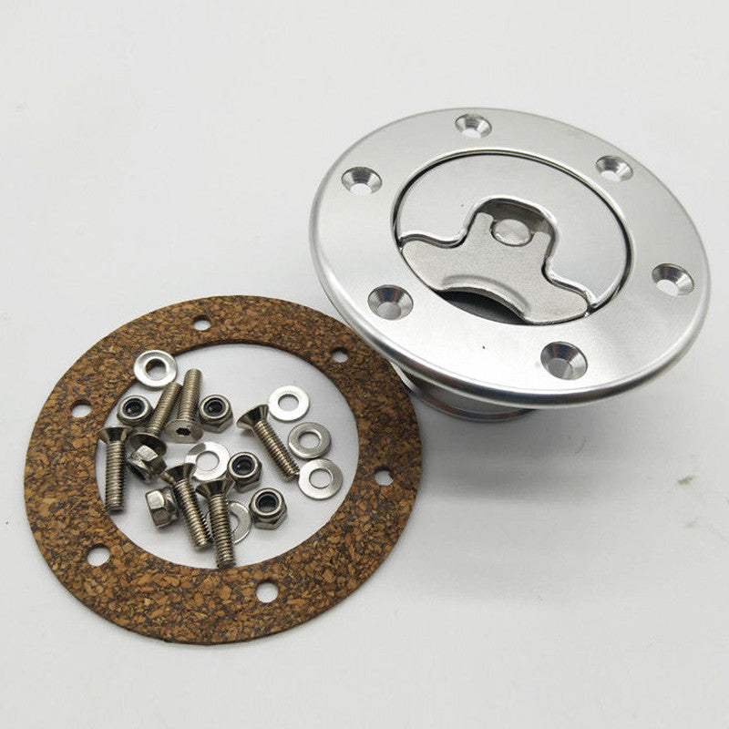 Silver aluminum alloy aircraft-style fuel cell tank cap with embedded mounting and 6-hole anodized finish. n