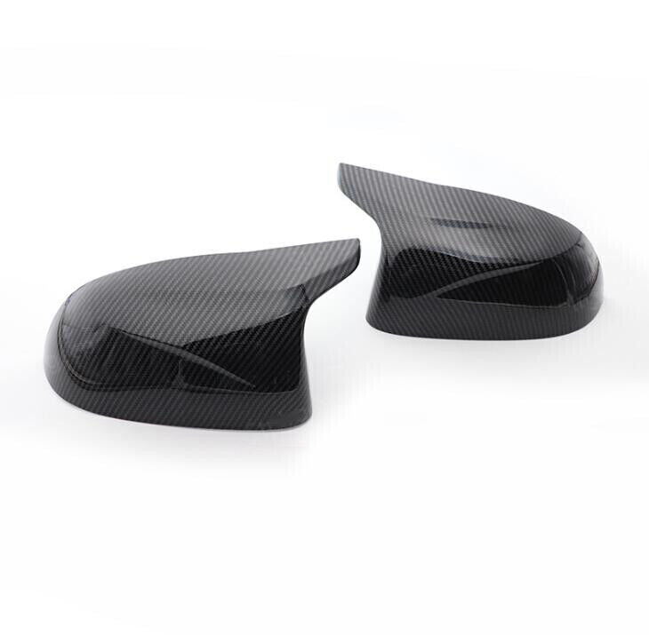 Carbon fiber bullhorn-shaped rearview mirror cover trim for BMW X5, F15, and X6 (2014-18). Q