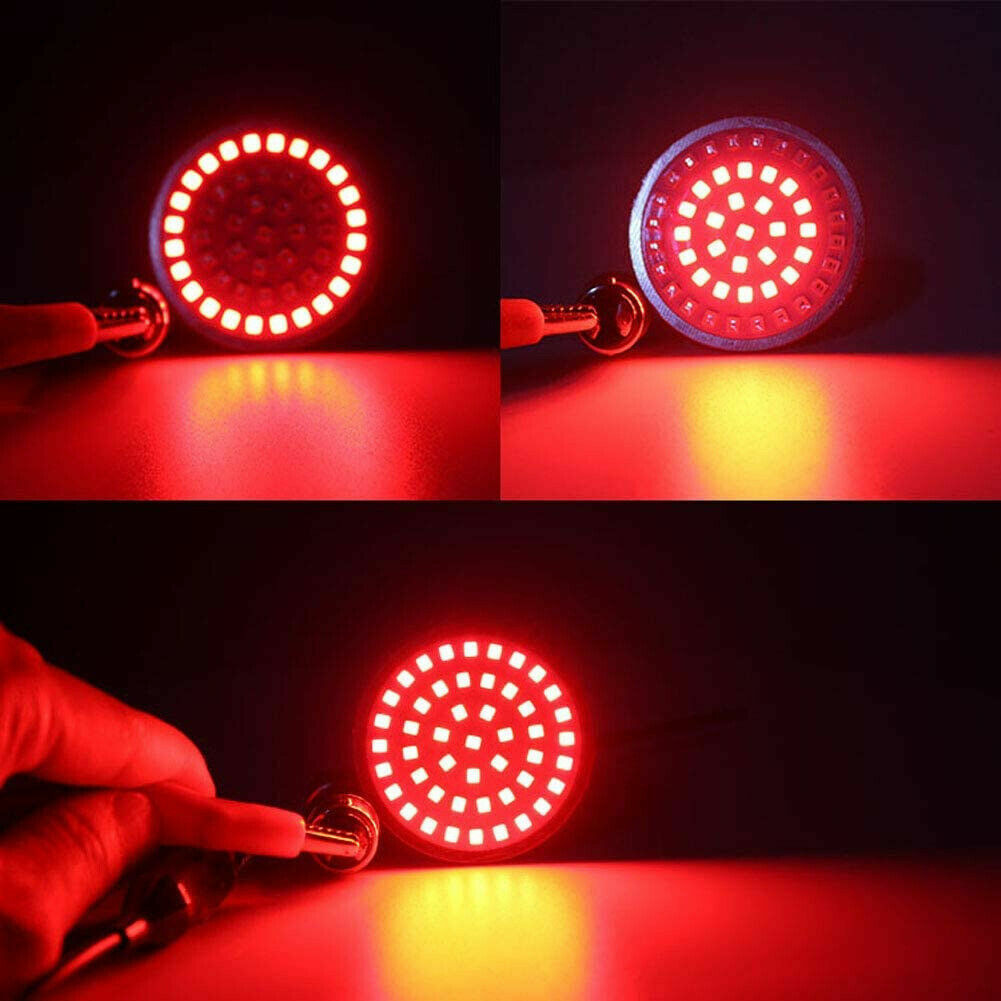 A pair of LED 1157 turn signal smoke lenses for Harley Touring Softail in amber red.