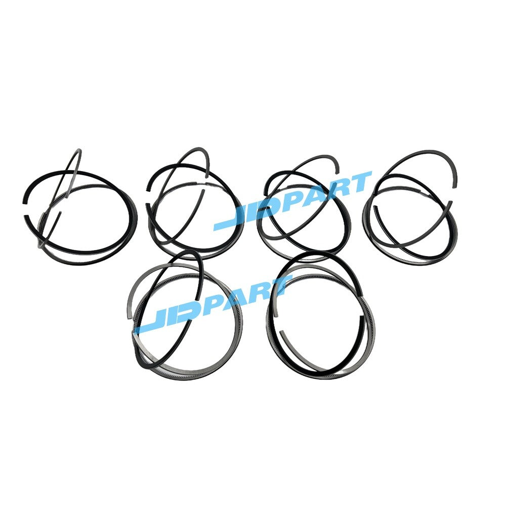 Premium 6-piece QSM11 piston ring kit for diesel engines.