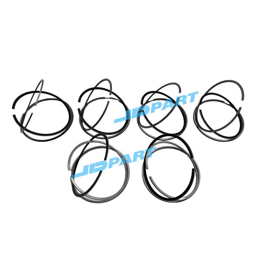 Premium 6-piece QSM11 piston ring kit for diesel engines.