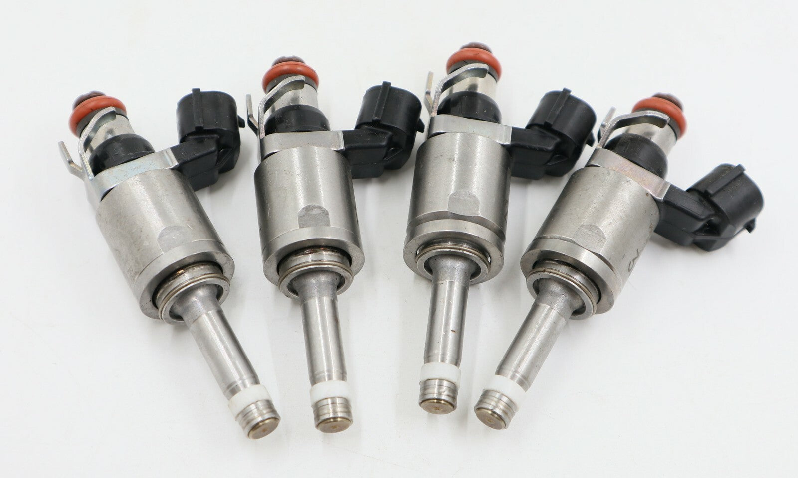 4-pack of new fuel injectors for Ford and for Mazda P501-13-250A.