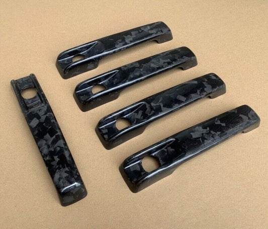 forged carbon fiber door handle cover kit for Mercedes-Benz W464, G-Class, G55, and G63.