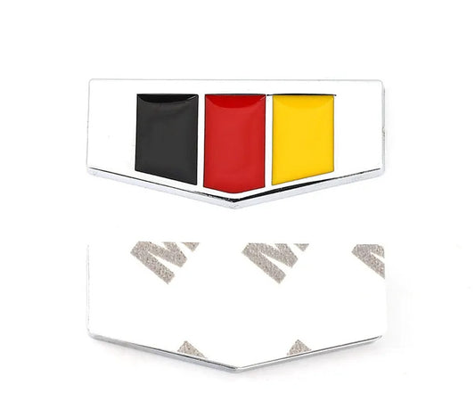 Silver metallic German flag badge sticker on the rear of the car's side fender and trunk.