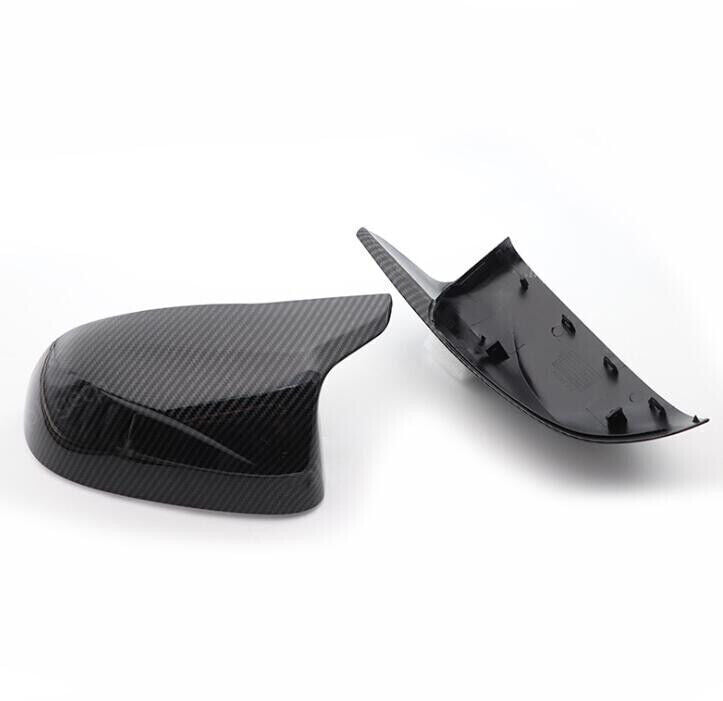Carbon fiber bullhorn-shaped rearview mirror cover trim for BMW X5, F15, and X6 (2014-18). Q